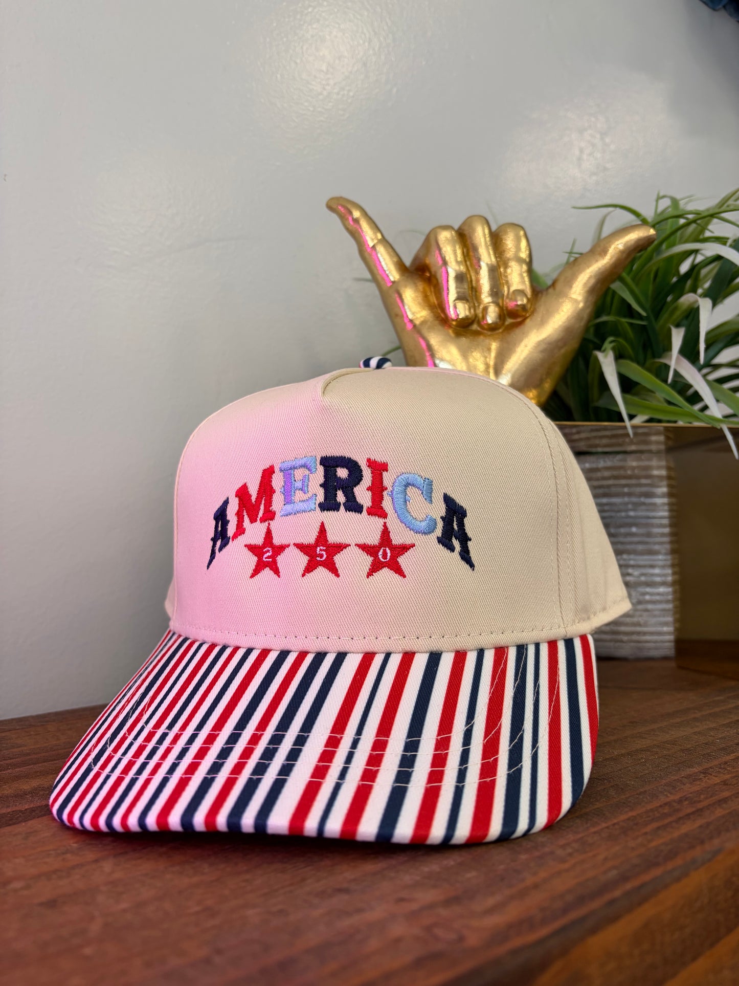 Stripe bill embroidered America 250 hat.